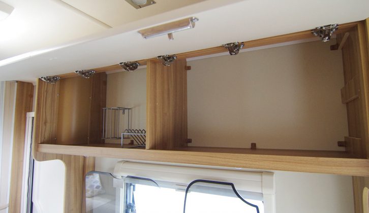 Storage areas include large overhead lockers for  crockery and groceries