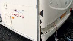 The caravan panel is cleaned and stripped of all decals, lights and other equipment so the full damage can be examined. The affected portions are removed