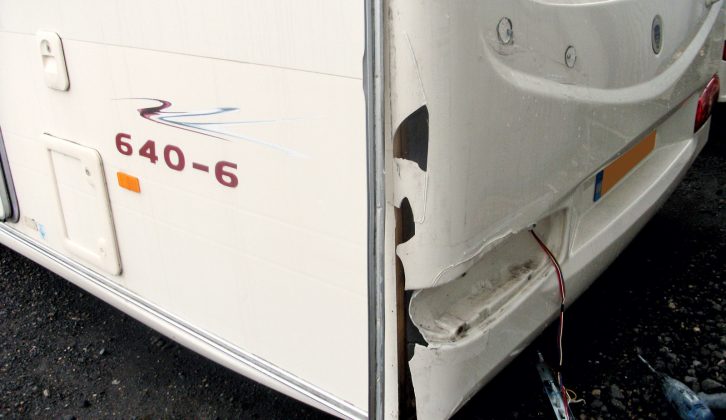 The caravan panel is cleaned and stripped of all decals, lights and other equipment so the full damage can be examined. The affected portions are removed