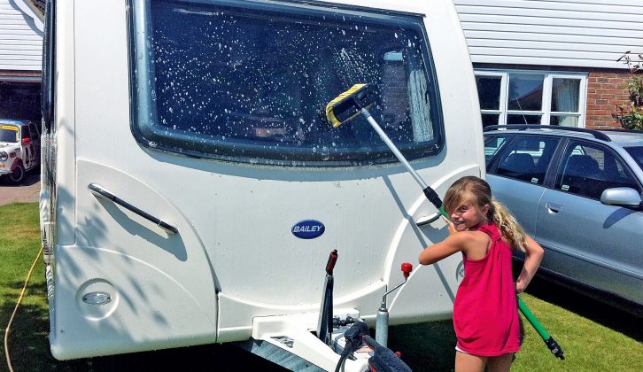 Daughter Morgan washes the van in exchange for some pocket money ahead of the race