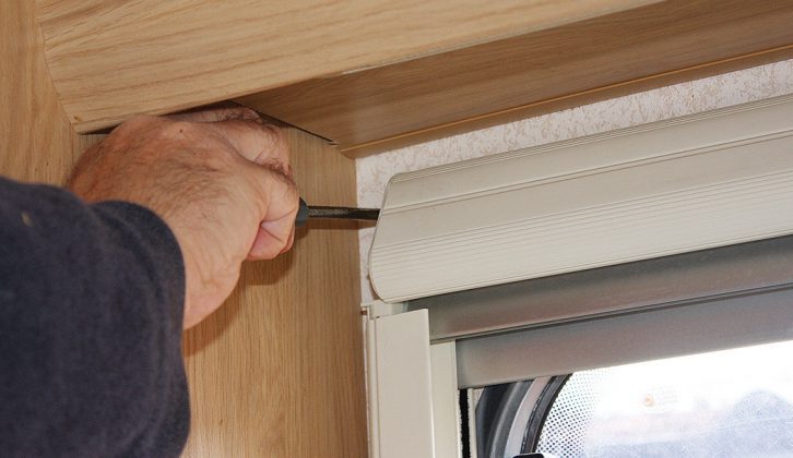 Undo the top screws of the Seitz roller blind cassette. To make the next steps of this task easier, lay the unit on a flat surface