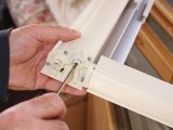 The right-hand slot is for the caravan blind’s roller. Insert a flat-bladed screwdriver into the slot
