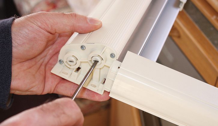 The right-hand slot is for the caravan blind’s roller. Insert a flat-bladed screwdriver into the slot