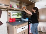 The galley is well equipped with appliances, storage and workspace for such a compact zone