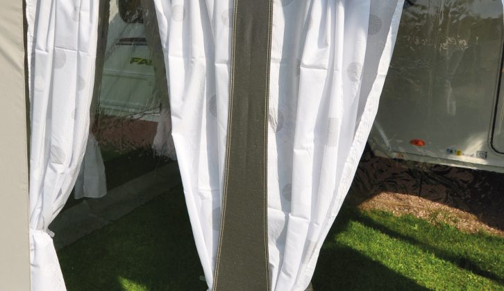 White curtains may not be ideal if you want night-time blackout in the awning so that someone can sleep in it