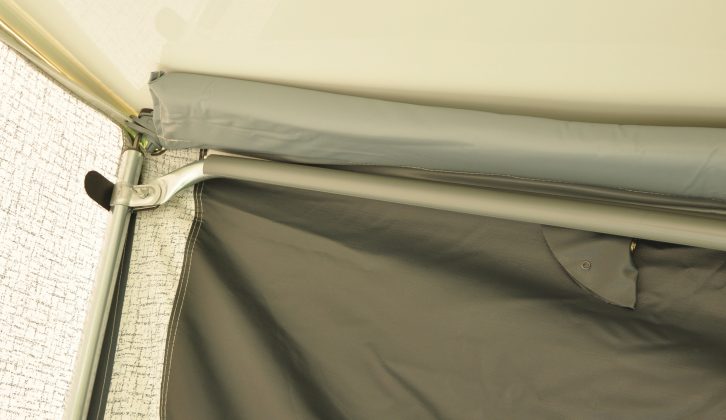 Poles and pads ensure a snug fit against the side of the caravan