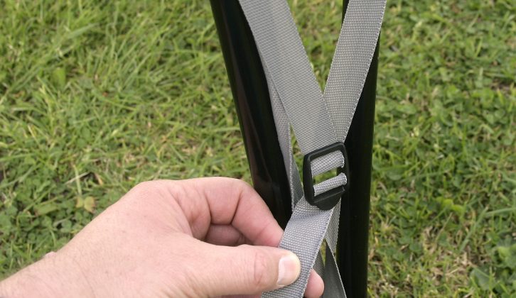 A strap arrangement hooks into the foot, and allows the cover to be pulled very tautly across the frame