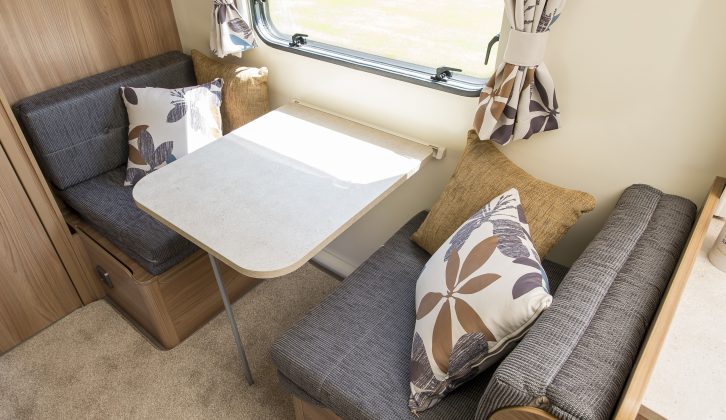 This side dinette, opposite the fixed bunks, can form a single bed – a bunk over it is an option