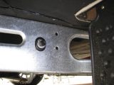Locate the pre-punched holes (on vans built since 1991) on each side of the caravan