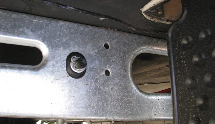 Locate the pre-punched holes (on vans built since 1991) on each side of the caravan