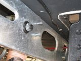 With the bracket inside the chassis, feed the bolts – heads inside – through the holes; read more with Practical Caravan's expert advice