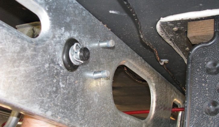 With the bracket inside the chassis, feed the bolts – heads inside – through the holes; read more with Practical Caravan's expert advice