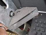 Put the outer jack mounting bracket onto the ends of the bolts, with the slot at the bottom