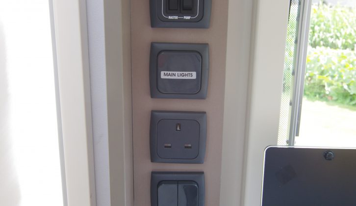 Sockets and switches are grouped together and out the way in the kitchen area