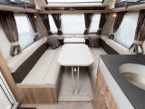 In the 2016 Swift Conqueror 565 there are twin fixed singles at the rear and a two-tone lounge