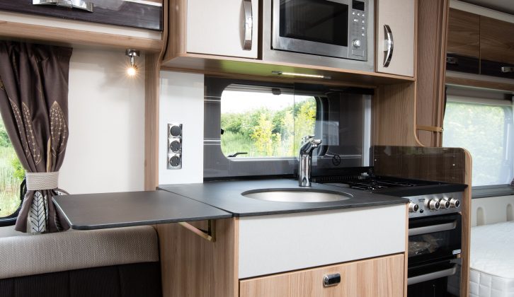 The worktops are made of a more scratch-resistant material, while the kitchen has a separate oven and grill, plus a microwave
