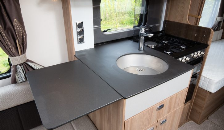 The fold-out flap boosts food preparation space and there's a dual-fuel hob in the 2016 Swift Conqueror 565