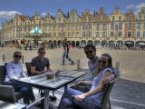 Visit France and as well as watching Le Tour, you can enjoy al fresco dining in pretty town squares, such as here in Arras