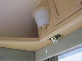 As mains hook-ups became more common on campsites, caravans were often provided with both 230V and 12V light fittings