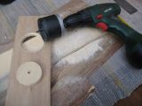 One way to create a mounting point for a recessed light fitting is to use a power drill and hole saw of the appropriate size