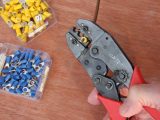 Crimp-fit terminals are coloured to suit different cable thicknesses – it is worth buying a good crimping tool like this
