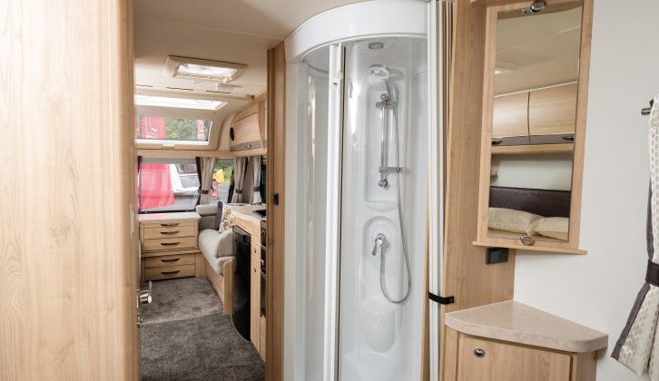 The large, separate, circular shower cubicle in the Aurora has a new water-saving showerhead