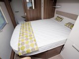 The island bed can be slid into day mode to create more space around it in the 2016 Venus 570/4