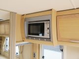 Over the last 20 years microwave ovens have become popular, and it's easy to put one in an old caravan