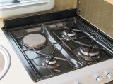 Most UK caravans have a hob with at least three gas burners, a 230V hotplate and a glass lid
