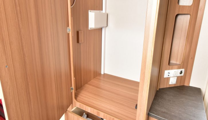 The wardrobe has useful drawers beneath the hanging space