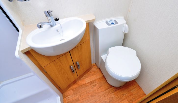 Although the washroom is amidships, this space accommodates a toilet, a basin and a separate shower