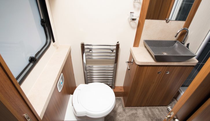 There’s no need to swivel the loo in this classy washroom, with its heated towel rail