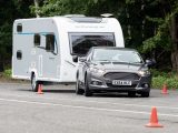 Despite body roll, light steering and the tourer’s skidding behind it, the Mondeo stayed on course and pulled the caravan straight again in our lane-change test