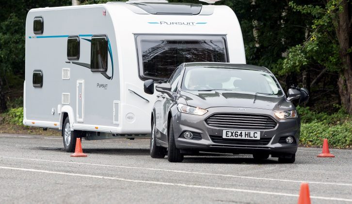 Despite body roll, light steering and the tourer’s skidding behind it, the Mondeo stayed on course and pulled the caravan straight again in our lane-change test