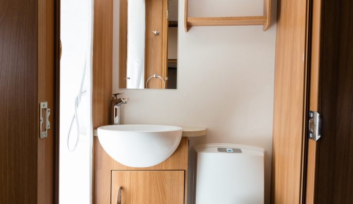 The washroom has a Thetford C260 swivel loo,  an opening roof vent and separate shower