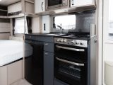 The kitchen boasts a full dual-fuel Thetford Aspire cooker, fridge and microwave oven