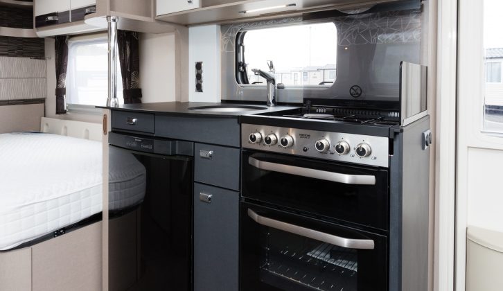 The kitchen boasts a full dual-fuel Thetford Aspire cooker, fridge and microwave oven