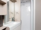 A fully lined shower cubicle comes with a towel rail and huge EcoCamel shower head