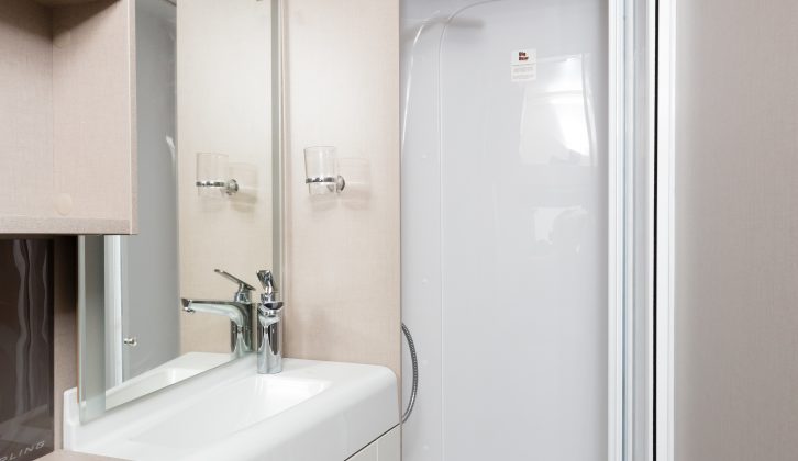 A fully lined shower cubicle comes with a towel rail and huge EcoCamel shower head