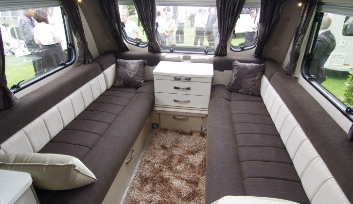 The Elite 530's lounge boasts dark high-gloss wood and Ronda soft furnishings, with a fluffy rug