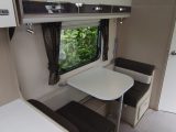 Put the children to bed in the converted dinette and close the privacy curtain