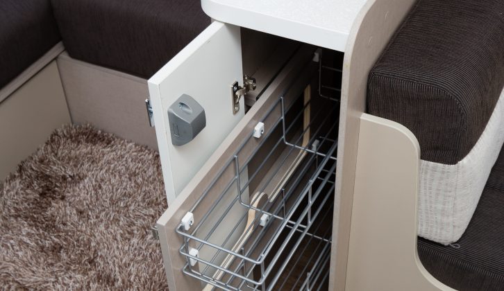 Pull-out wire baskets make the most of this slim cupboard