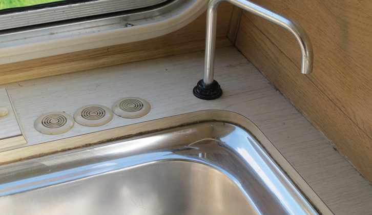 Instead of a controllable tap, this faucet is fitted to deliver water from a manual cold pump in the caravan