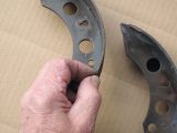 This caravan's brake shoe lining is badly worn. Get all shoes replaced and the system serviced