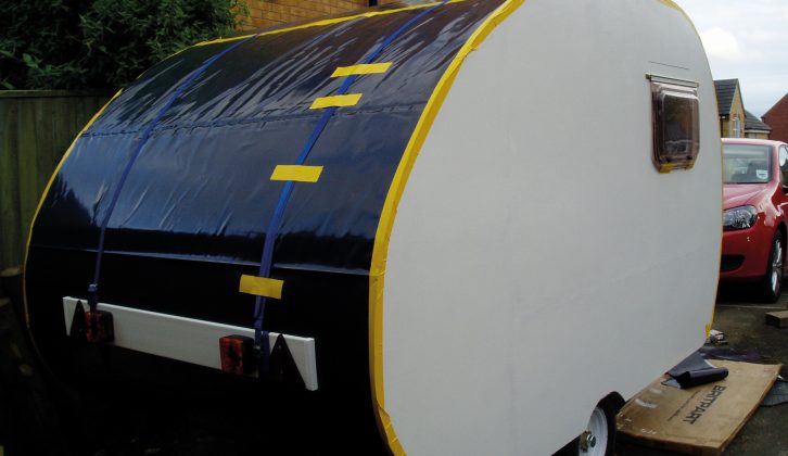 For the first trip the caravan waterproofing was black plastic sheeting  held in place by tape