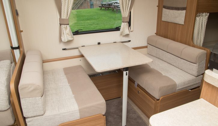 The sides of the double dinette pull out to make a 1.81 x 1.14m double bed, but take up floor space