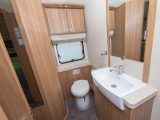A wardrobe occupies a corner of the end washroom in the Compass Rallye 636 – read more in the Practical Caravan review