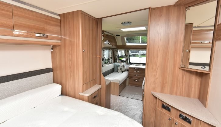 There's a neat corner vanity unit at the foot of the 1.85m x 1.33m island double bed, with TV connection points
