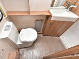 The Swift Challenger 580's end washroom has an electric-flush toilet, and a stylish washbasin and tap