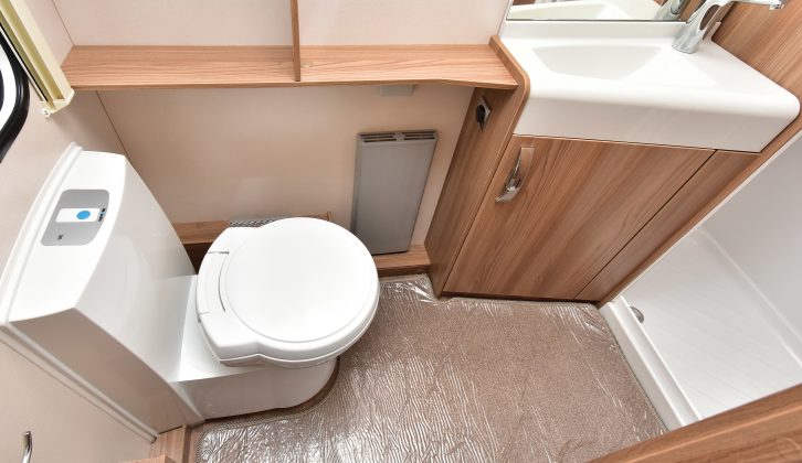 The Swift Challenger 580's end washroom has an electric-flush toilet, and a stylish washbasin and tap